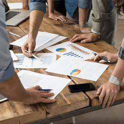 Group of people reviewing documents at a conference table