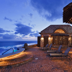 Waterside patio with lounge chairs